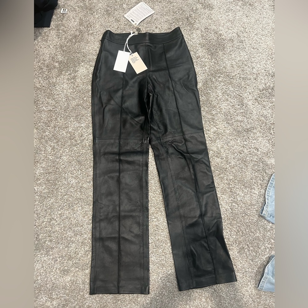 Black faux leather pants size 38.